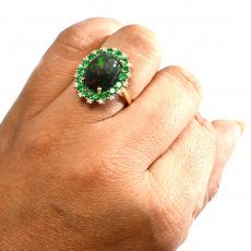 Ethiopian Black Opal Cab Oval 4.59 Carat Ring in 14K Yellow Gold with Diamond and Emerald Accents