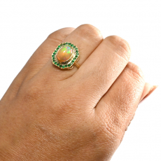 Ethiopian Opal Cab Oval 1.68 Carat Ring in 14K Yellow Gold with Emerald Accents