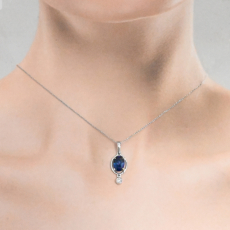 Nigerian Blue Sapphire Oval 1.63 Carat Pendant In 14K White Gold With Accented Diamonds (Chain Not Included).